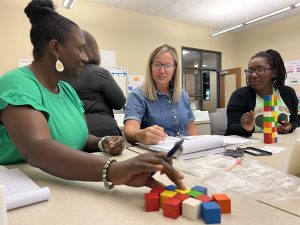 Three teachers experiment with using cubes to represent math concepts.
